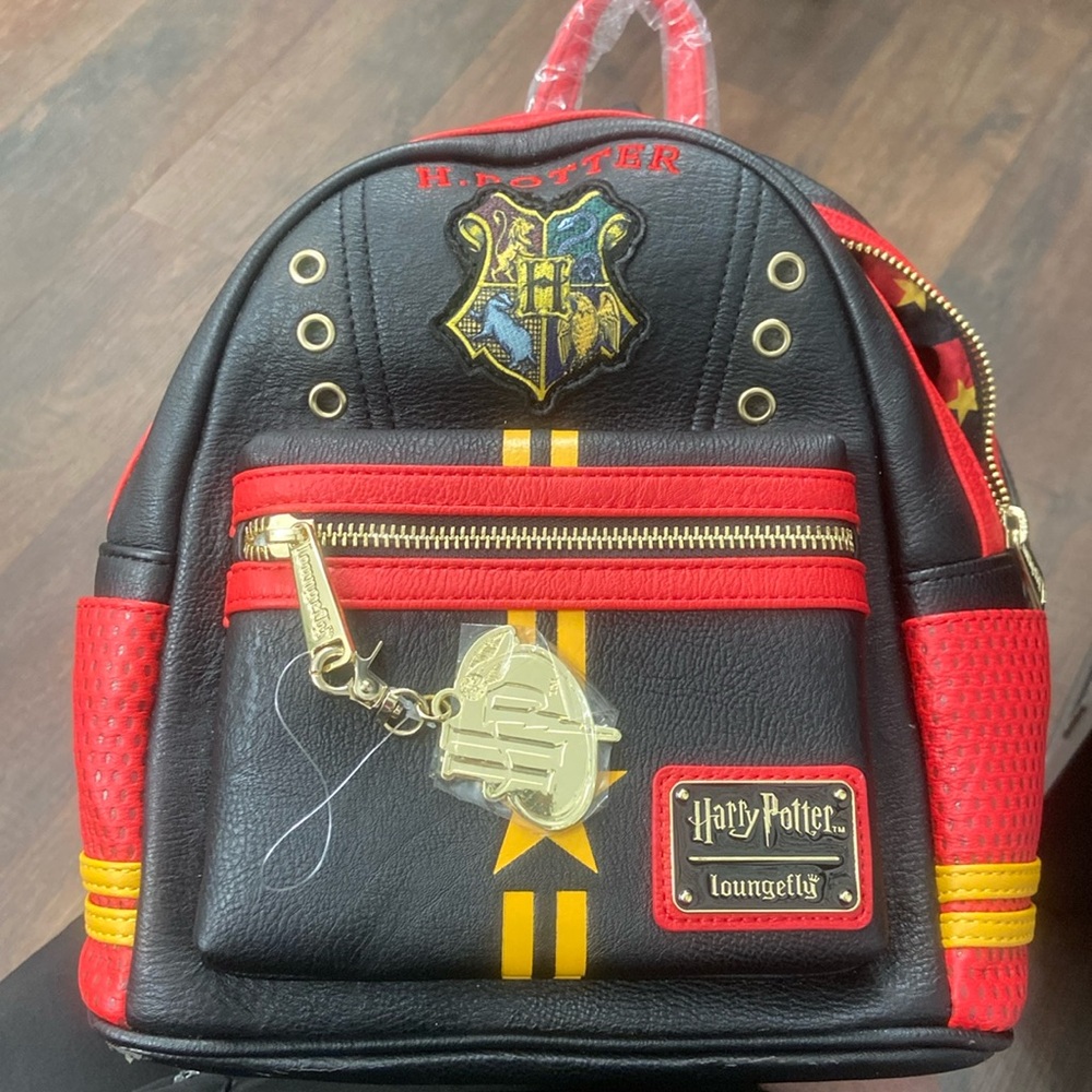 Loungefly Harry Potter Backpack NWT but small corner flaw from storage $129